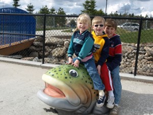 discovery spokane 1 Children playing on steelhead trout in accessible splash pad